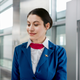 Illustration for article titled Flight Attendant Licks Her Lips As Traveler Approaches Gate With Large Suitcaseem/em